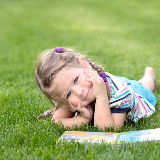 kid-reading-grass